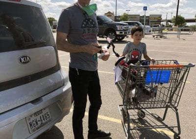 Jim with a child in a shopping cart