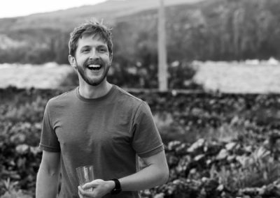 photo of a man smiling in a vineyard